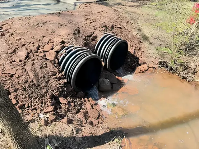 Corrugated plastic pipes installed for agricultural farm drainage and erosion control